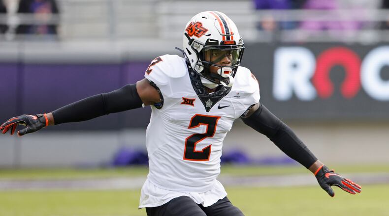 FILE - Oklahoma State safety Tanner McCalister (2) runs the field against TCU during the second half of an NCAA college football game Saturday, Dec. 5, 2020, in Fort Worth, Texas. Oklahoma State plays against Baylor in the Big 12 championship game on Saturday, Dec. 4. (AP Photo/Ron Jenkins, File)