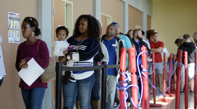 No-fault absentee voting, also known as early voting, was instituted in 2005. It’s evolved over there years, including at one point where voters could register to vote and cast a ballot during the first week of early voting, but that option was revoked by Ohio lawmakers. Today, voters can vote early at a county board of elections office or by mail in the 28 days before Election Day. Pictured are early voters at the Butler County Board of Elections during the 2016 general election. MICHAEL D. PITMAN/FILE