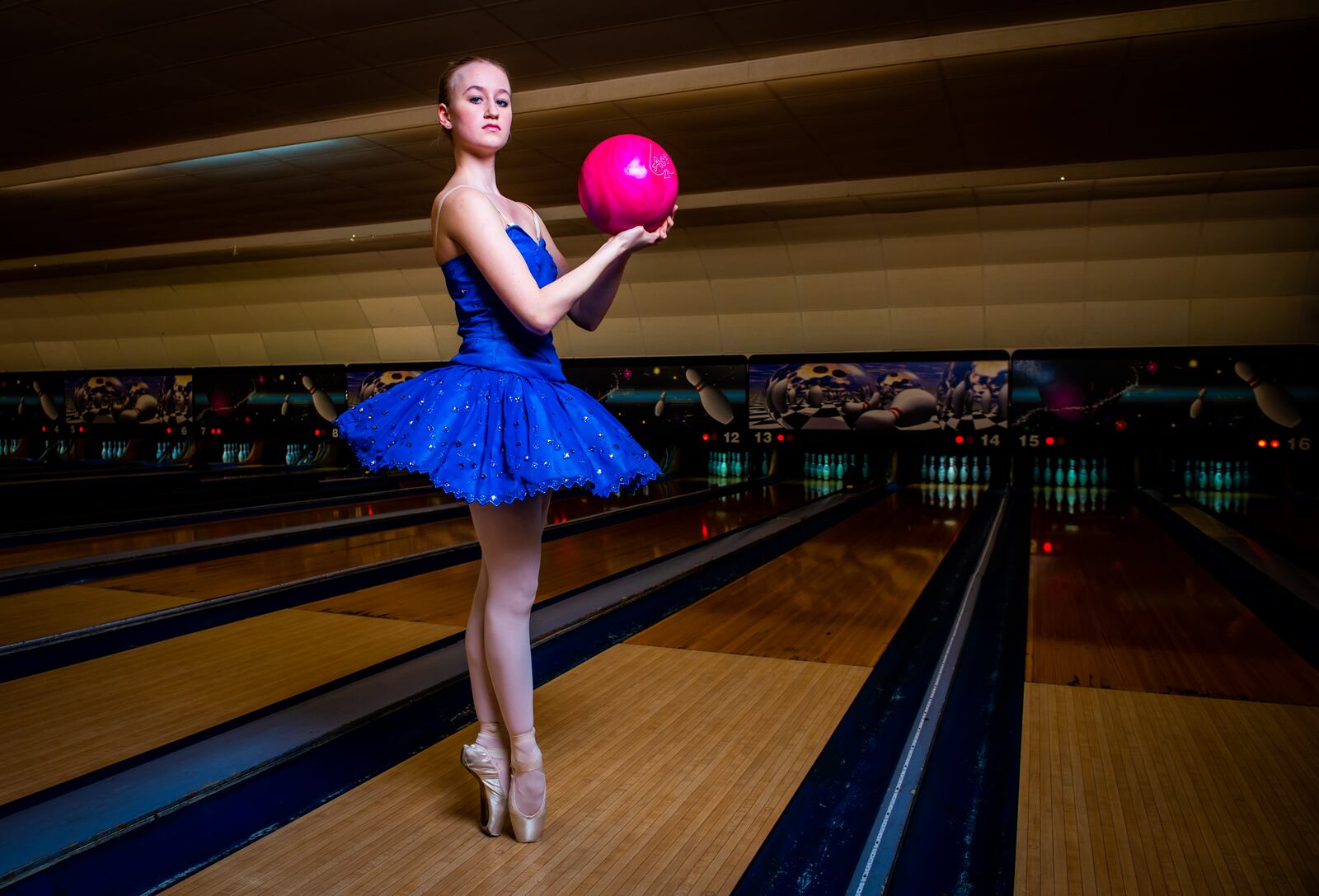 Clare Sherman, 15, with Miami Valley Ballet Theatre, poses for a photo at Pohlman Lanes and Family Entertainment Complex on Pyramid Hill Blvd. in Hamilton.
  Hamilton’s very own Miami Valley Ballet Theatre dancers are trading out their ballet slippers for bowling shoes, for a very special performance at Pohlman Lanes. Their brand new show is a Fab Four inspired production featuring the music of the Beatles that features an exciting mix of contemporary and modern dance. The Ballet, Beatles and Bowling show is part of Fitton Center's "Outside The Box" series showcasing live arts at around Hamilton. The performance is Sunday, April 11 from 3-5 p.m. NICK GRAHAM / STAFF 