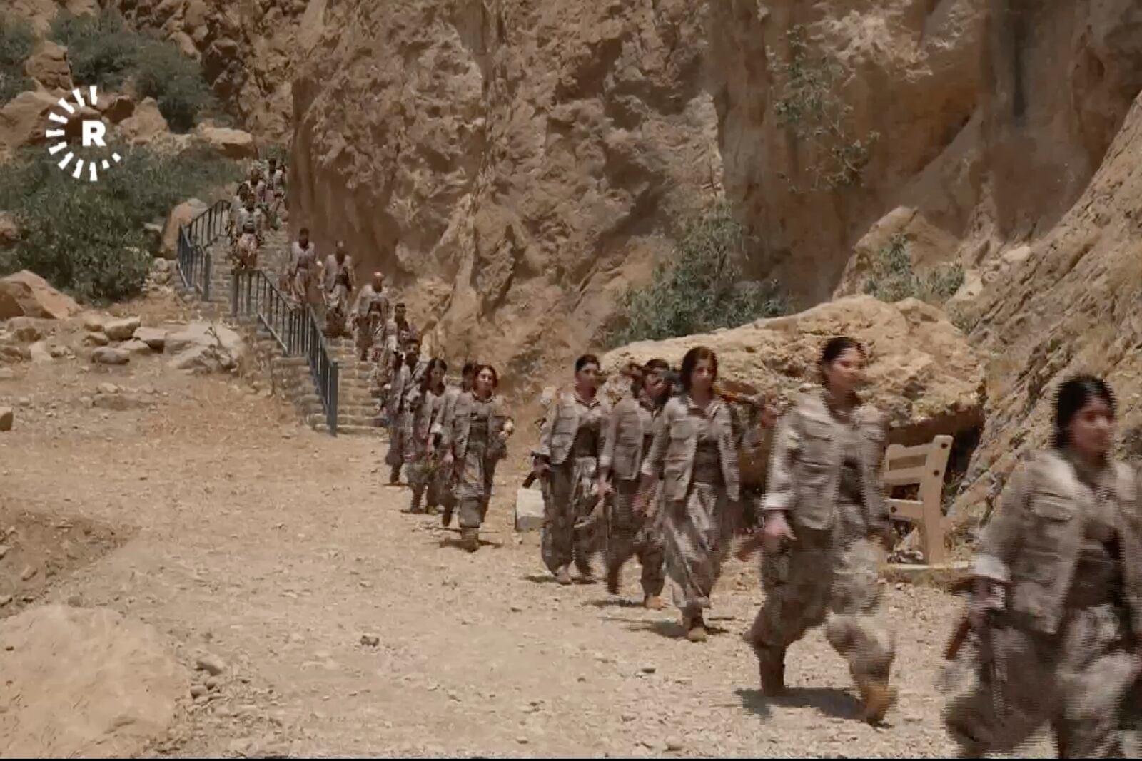 This frame grab from a video released by Rudaw TV shows PPK ( Kurdistan Workers' Party ) fighters arriving for a symbolic disarmament ceremony as part of the peace process with Turkey, in Sulaymaniyah governorate, Iraq's semi-autonomous Kurdish region, Friday, July 11, 2025. ( Rudaw TV via AP)