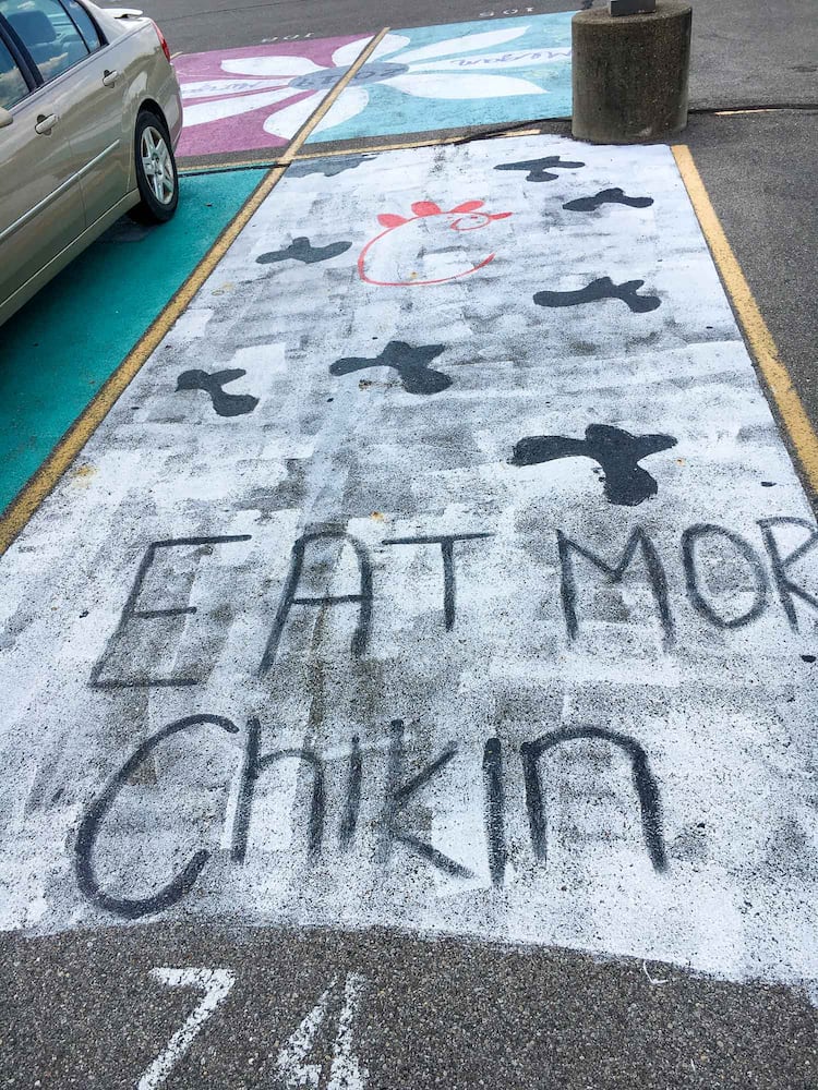 PHOTOS Lakota East seniors paint parking spots