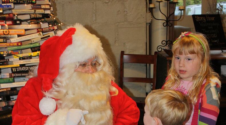 The annual Olde West Chester Christmas Walk will be held on Nov. 18 at businesses and organizations located along Cincinnati Dayton Road, in Olde West Chester. Pictured is Santa greeting children at a previous year’s Olde West Chester Christmas Walk. CONTRIBUTED