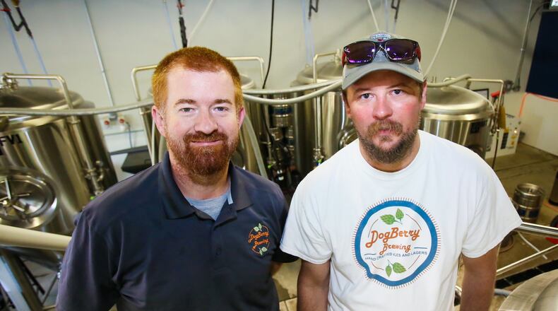 Reach Out Lakota and DogBerry Brewing are teaming up in a unique fundraising venture. DogBerry will donate a portion of proceeds from the sale of “Reach Out Lakota” themed brews beginning in April. Pictured here are DogBerry Brewing owners Tony Meyer and Chris Frede in their new location at 9964 Crescent Park Drive in West Chester, Wednesday, May 31, 2017. GREG LYNCH / STAFF