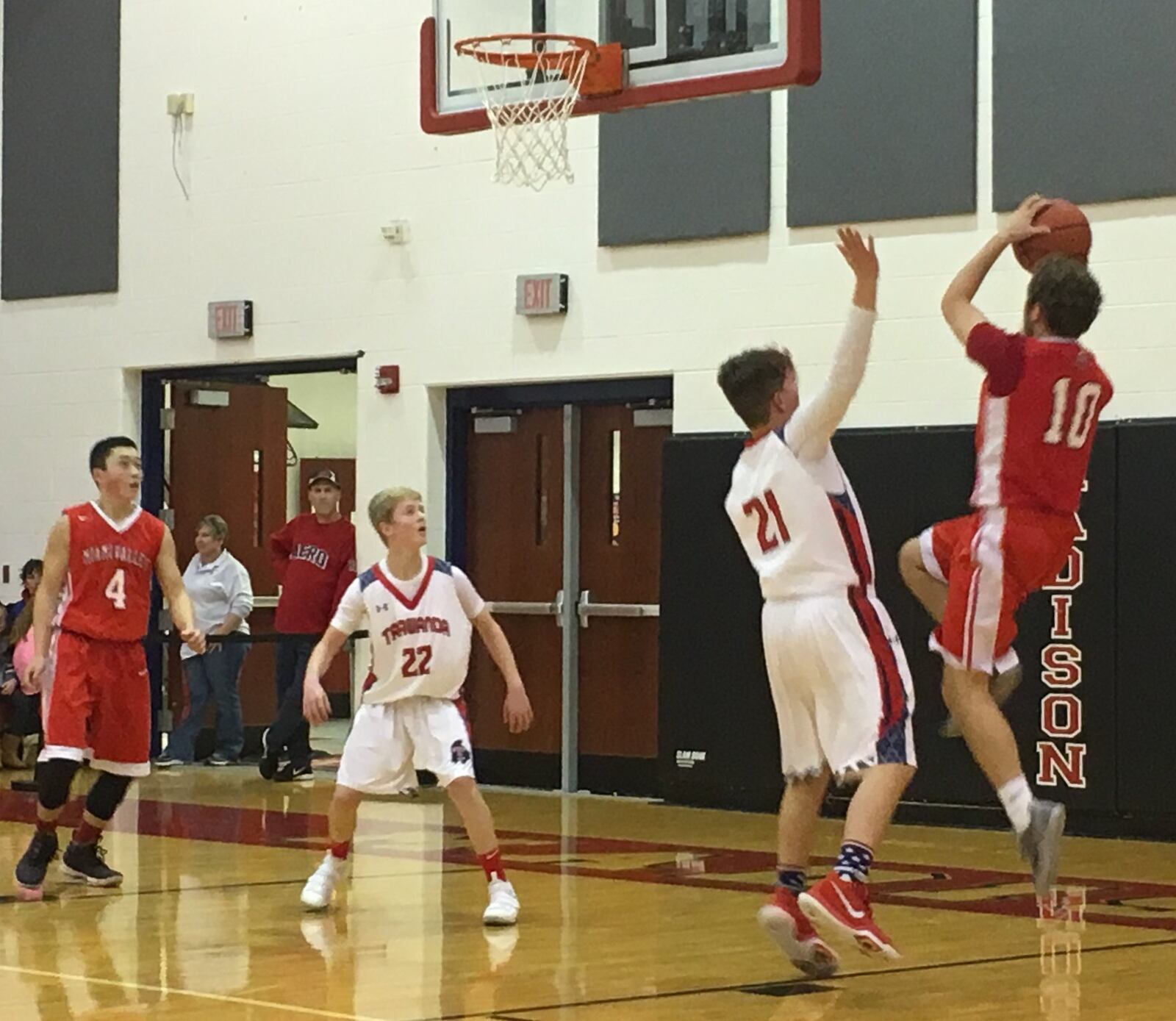 Miami Valley’s Alec Martin (10) shoots over Talawanda’s Matthew Bowling (21) on Thursday night at Madison during the Brian Cook Classic. Getting position under the basket are Talawanda’s Craig James (22) and Miami Valley’s Jake Wang (4). THS advanced with a 51-48 triumph. RICK CASSANO/STAFF