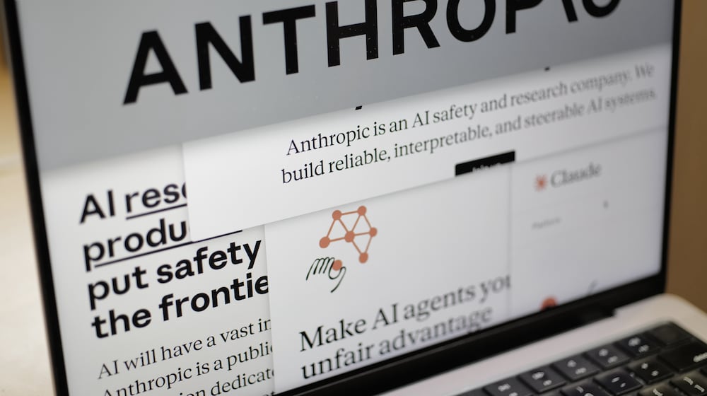 Pages from the Anthropic website and the company's logo are displayed on a computer screen in New York on Thursday, Feb. 26, 2026. (AP Photo/Patrick Sison)
