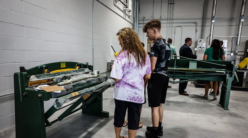 Ethan Drake and his mom, Theresa attended the ribbon cutting of the Wayne High School Career Tech Center Thursday August 10, 2023. Ethan plans to attend the new facility. JIM NOELKER/STAFF