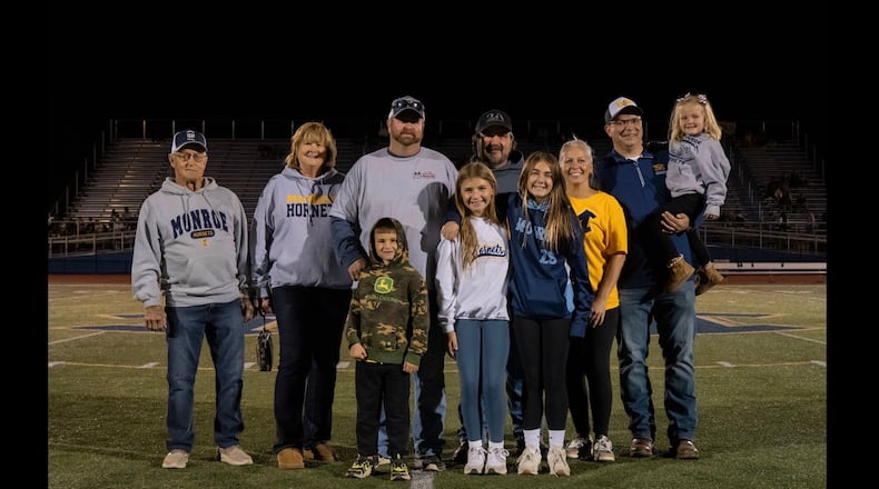 Members of the Majors family, owners of Majors Farms in Monroe, made a $15,000 donation Friday night during halftime of the high school football game, to the athletic program and the Pee Wee football teams and cheerleaders. SUBMITTED PHOTO