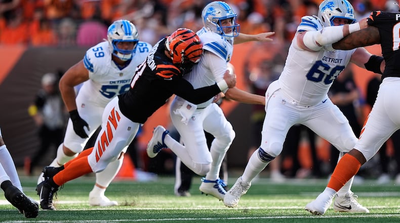 Cincinnati Bengals defensive end Trey Hendrickson (91) causes Detroit Lions quarterback Jared Goff (16) to fumble during the first half of an NFL football game Sunday, Oct. 5, 2025, in Cincinnati. (AP Photo/Carolyn Kaster)