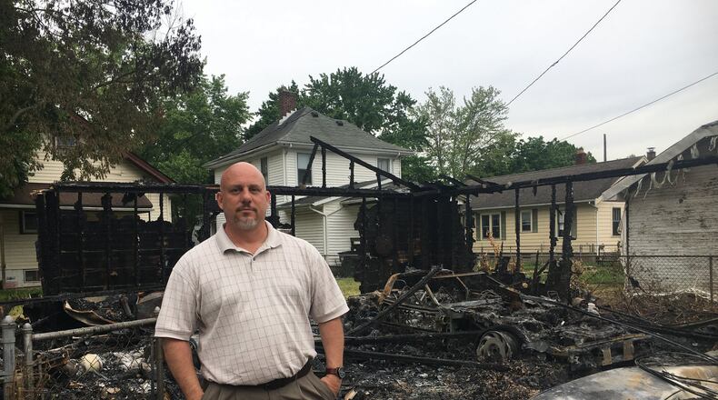 Hooven Avenue resident Glenn Rothwell is concerned about the number of people who walk area streets, trying locks of cars and stealing things. It really concerned him this month when a neighbor’s garage in an alley behind their homes burned down after someone set a fire in a nearby trash container. MIKE RUTLEDGE/STAFF
