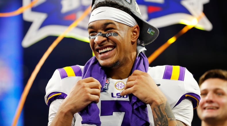 LSU safety Grant Delpit celebrates on the podium after winning the Chick-fil-A Peach Bowl 28-63 over the Oklahoma Sooners at Mercedes-Benz Stadium on December 28, 2019 in Atlanta, Georgia. (Photo by Kevin C. Cox/Getty Images)