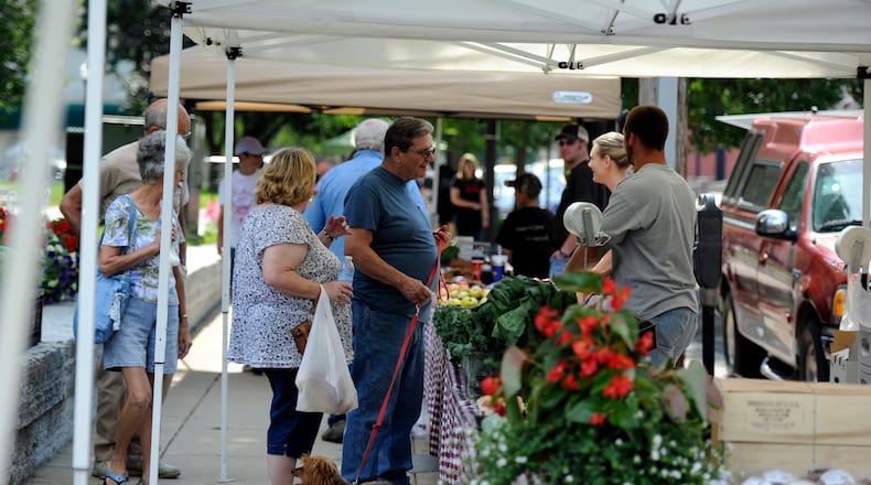 Hamilton’s Historic Farmer’s Market takes place around the Butler County Courthouse from the end of May through September. STAFF FILE PHOTO