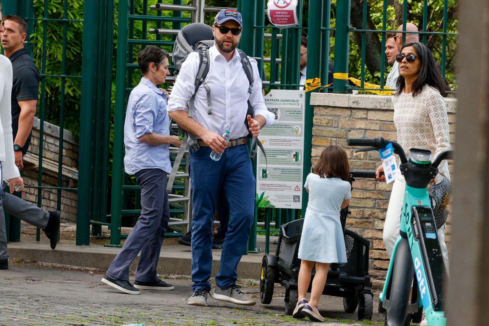 US Vice President J.D. Vance leaves Rome's Botanic Gardens with his wife Usha, right, and their daughter Mirabel, back to camera, Saturday, April 19, 2025. (AP Photo/Riccardo De Luca)