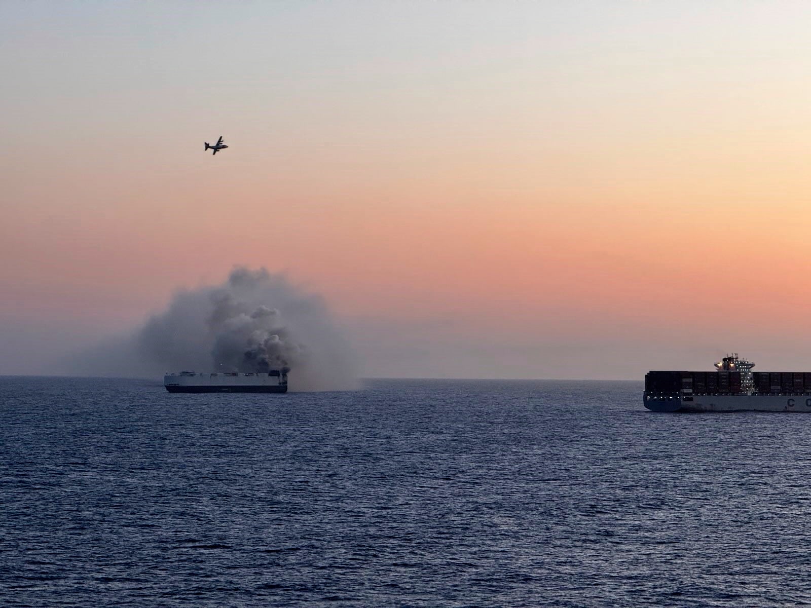 In this photo provided by the U.S. Coast Guard, smoke rises from the cargo vessel Morning Midas approximately 300 miles south of Adak, Alaska, June 3, 2025, as the crew of the cargo ship carrying about 3,000 vehicles to Mexico, abandoned ship after they could not control a fire. (U.S. Coast Guard/Courtesy of Air Station Kodiak via AP)