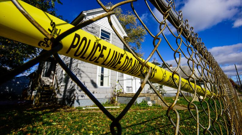 Police tape in front of the Lafayette Avenue home of Joe Romano, who was shot to death in November 2016. STAFF FILE/2016
