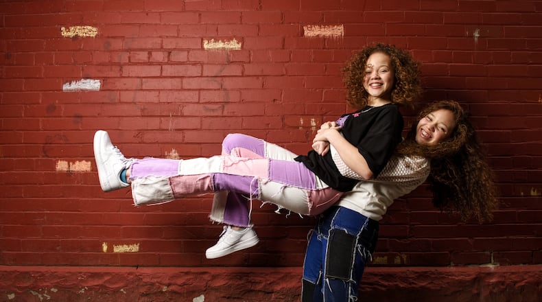 The Cunningham sisters, Marie, 13, left, and Macie, 15, have been singing on social media trying to spread a positive message and recently sent an audition video to the television show The Voice. NICK GRAHAM / STAFF