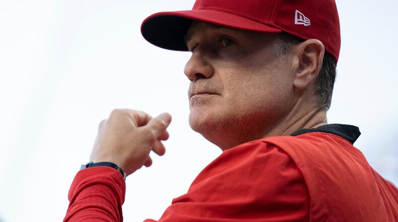 Cincinnati Reds manager David Bell stands in the dugout during the seventh inning of the team's baseball game against the Washington Nationals on Friday, June 3, 2022, in Cincinnati. (AP Photo/Jeff Dean)