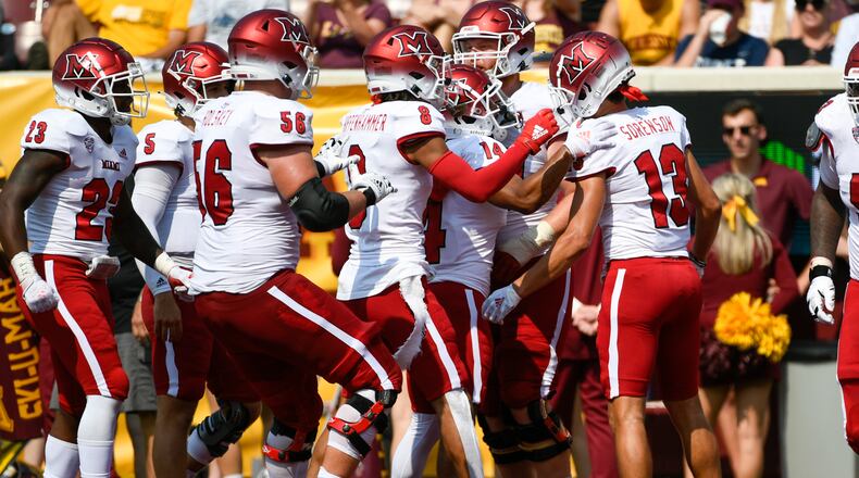 Miami-Ohio Wide Receiver Jack Sorenson (13) celebrates with his teammates after catching a 23-yard pass for a touchdown during the second half of an NCAA college football game against Minnesota, Saturday, Sept. 11, 2021, in Minneapolis. Minnesota won 31-26. (AP Photo/Craig Lassig)