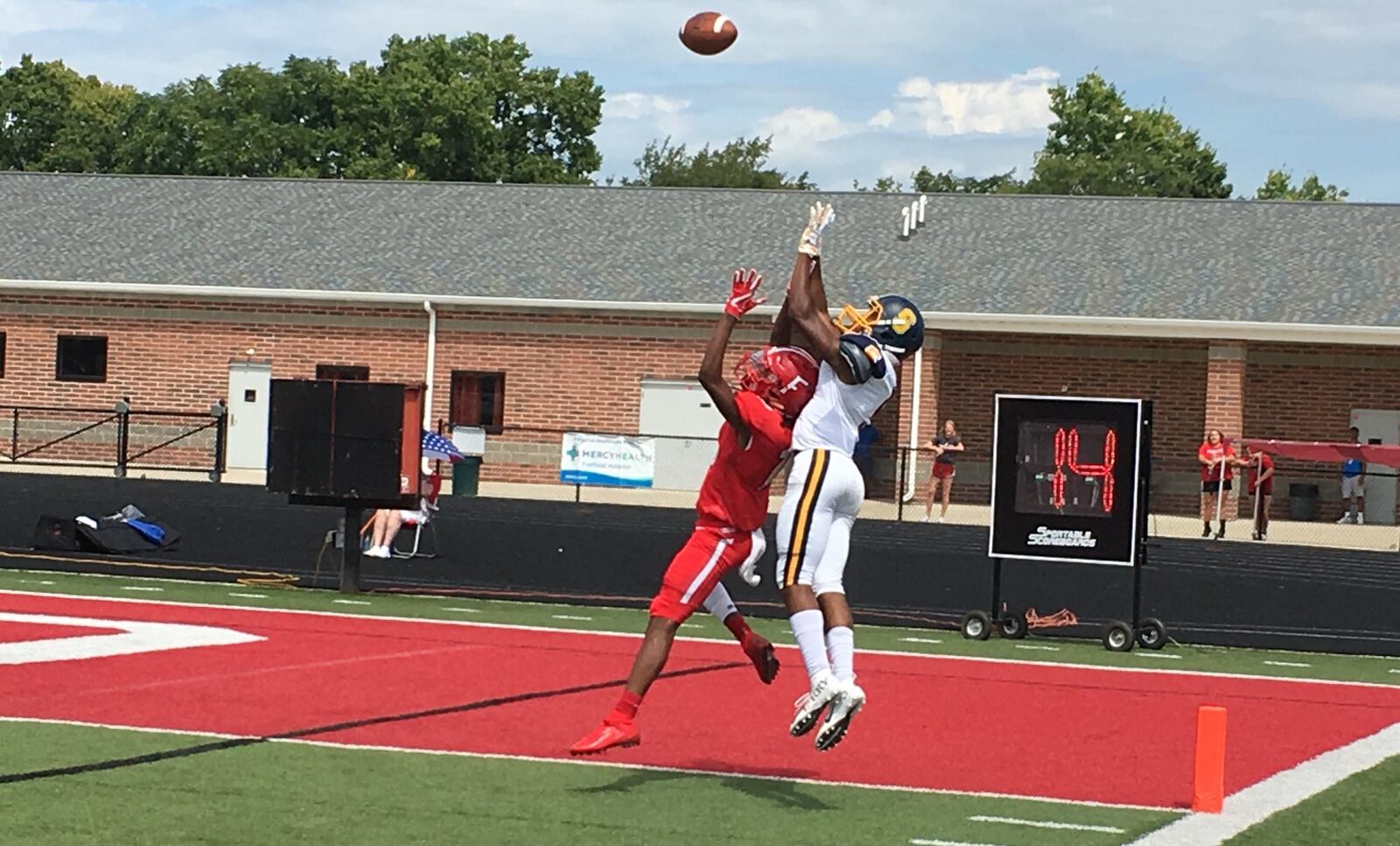 Springfield’s Larry Stephens (5) is about to catch a touchdown pass over Fairfield’s Jaylen Goins (18) with 1:13 remaining in Saturday afternoon’s game at Fairfield Stadium. The Wildcats added a two-point conversion and won 15-14. RICK CASSANO/STAFF