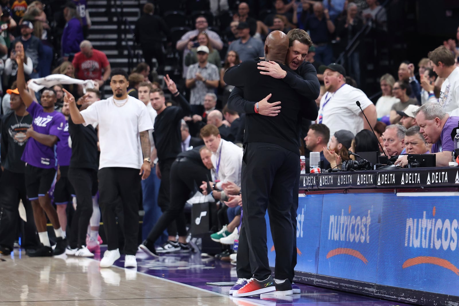 Utah Jazz head coach Will Hardy, right, and Portland Trail Blazers head coach Chauncey Billups embrace at the end of an NBA basketball game, Wednesday, April 9, 2025, in Salt Lake City. (AP Photo/Rob Gray)