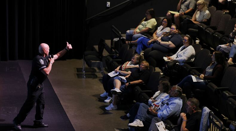 Hamilton Police Officer Brian Buchanan teaches a group what to do in emergency situations during a training program Tuesday, July 2, 2024 at Fitton Center for Creative Arts in Hamilton. NICK GRAHAM/STAFF