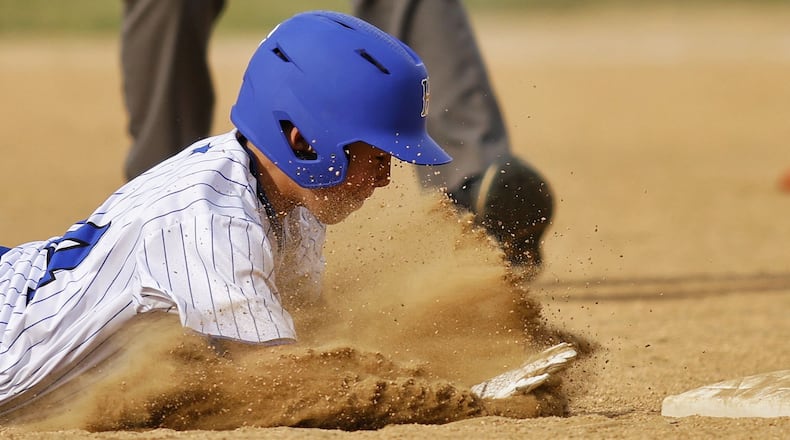 Hamilton’s Cole Vowell is called out at second base after sliding in head first during Hamilton West Side Little League's 10-1 win over Loveland in District 9 Little League championship Monday, July 11, 2022 at Home of the Brave Park in Loveland. NICK GRAHAM/STAFF