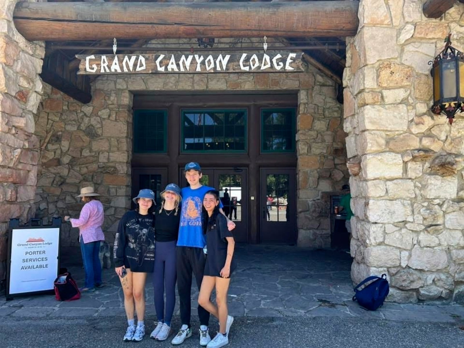 In this photo provided by Jen Pinegan, is her family standing in front of the Grand Canyon Lodge during the Fourth of July weekend, on the North Rim of Grand Canyon National Park, in northern Arizona, July 2025. (Jen Pinegan via AP)