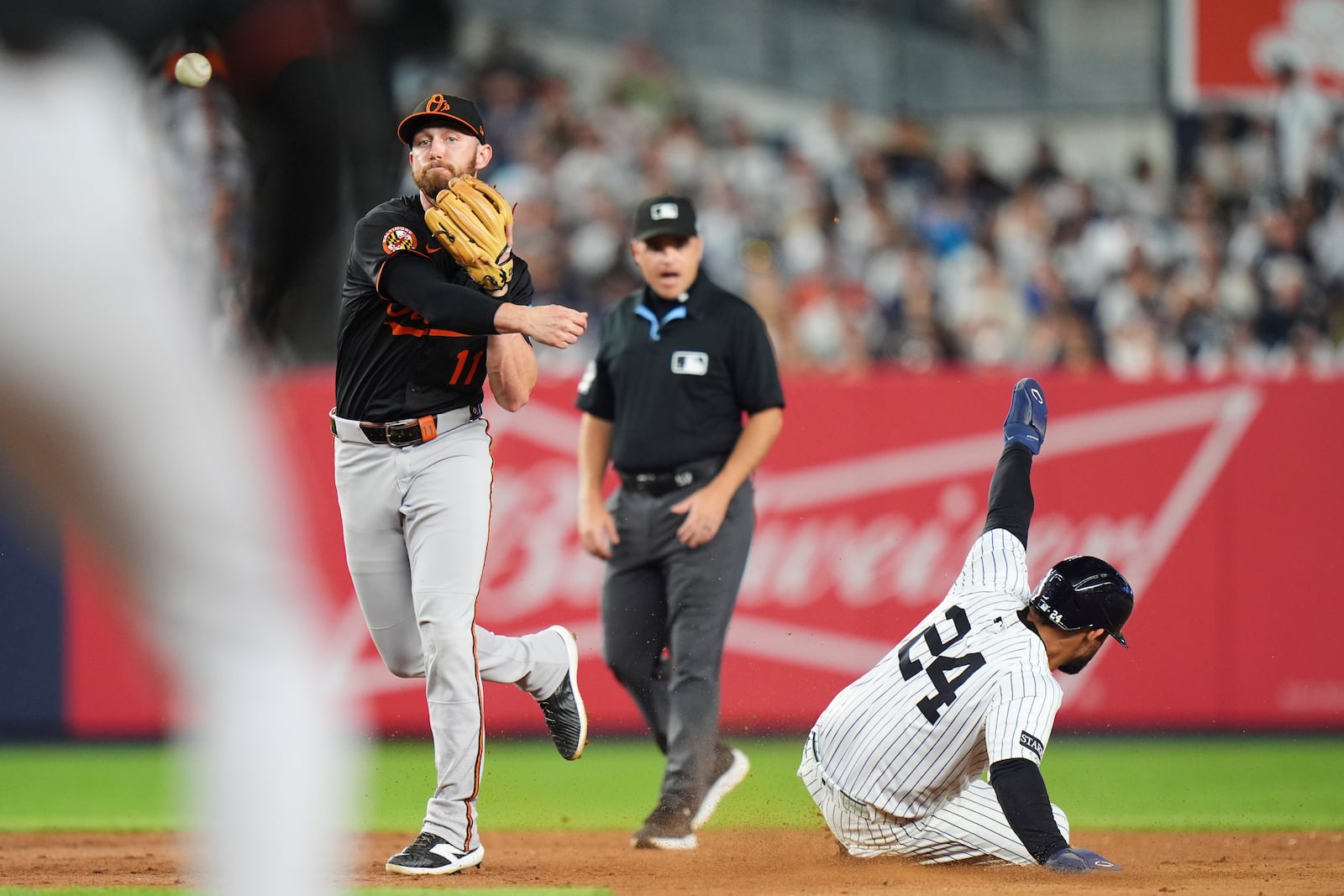 Baltimore Orioles' Jordan Westburg (11) throws to first base after forcing out New York Yankees' Jasson Domínguez (24) during the fifth inning of a baseball game Friday, June 20, 2025, in New York. (AP Photo/Frank Franklin II)