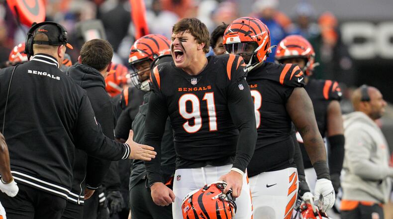 Cincinnati Bengals defensive end Trey Hendrickson (91) celebrates a sack as he comes to the sideline in the second half of an NFL football game against the Indianapolis Colts in Cincinnati, Sunday, Dec. 10, 2023. (AP Photo/Jeff Dean)