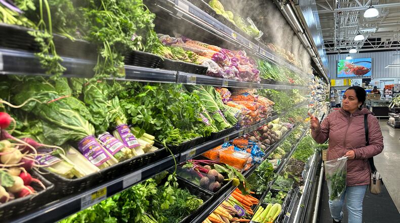 FILE - A person shops at a grocery store in Schaumburg, Ill., Monday, Feb. 9, 2026. (AP Photo/Nam Y. Huh, File)