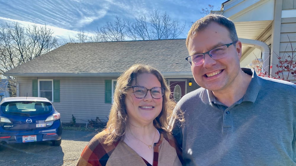 A local former military man got a surprise Veterans Day gift that will provide his family protection overhead for years to come with the installation of a free roof.
Through a partnership with Purple Heart Homes, Liberty Twp. U.S. National Coast Guard veteran Matthew Jones, shown with wife Jessica, was selected and approved as the recipient for a roof replacement on the national holiday. (Photo By Michael D. Clark/Journal-News)