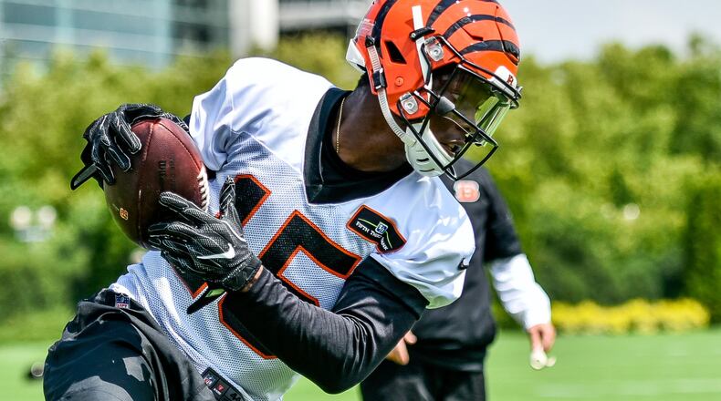 Wide receiver John Ross catches a pass during the first day of Cincinnati Bengals Training Camp Friday, July 28 at the practice fields beside Paul Brown Stadium in Cincinnati. NICK GRAHAM/STAFF