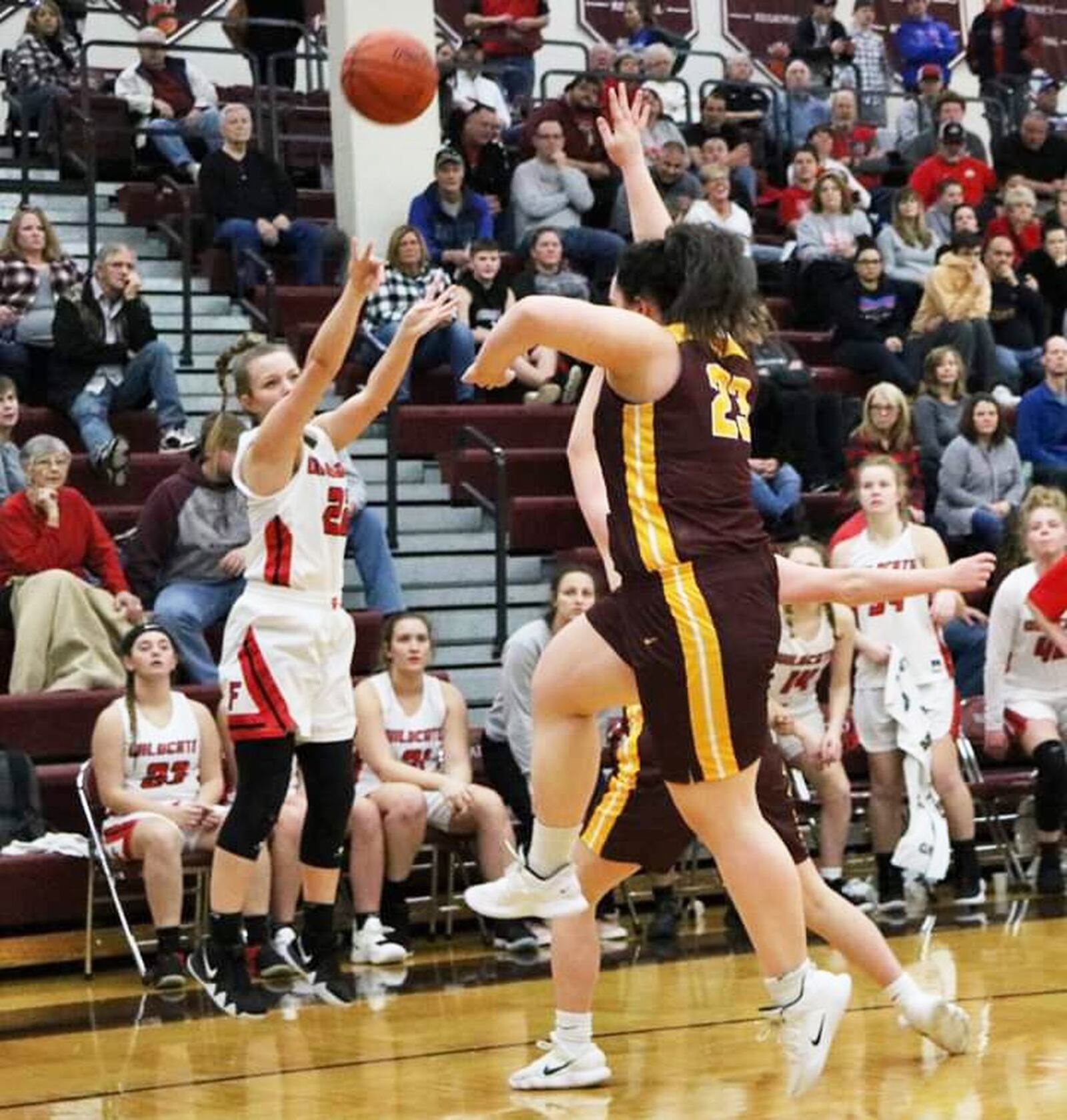 Franklin’s Madison Earles puts up a shot over Kellan Romans (23) of Ross during Saturday afternoon’s Division II sectional opener at Lebanon. Franklin won 53-16. CONTRIBUTED PHOTO BY TERRI ADAMS