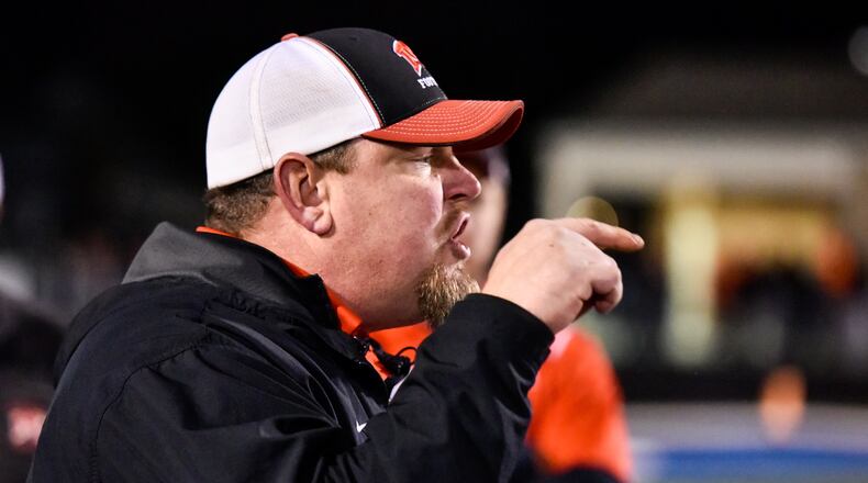 Madison coach Steve Poff speaks to his team after the 15-10 loss to Wheelersburg in a Division V state semifinal Nov. 24, 2017, at Herrnstein Field in Chillicothe. NICK GRAHAM/STAFF