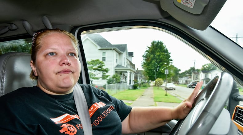 Jeri Lewis, a self-described missionary, spends time driving around Middletown communities looking for people to talk to, pray for and help out along her travels. NICK GRAHAM/STAFF