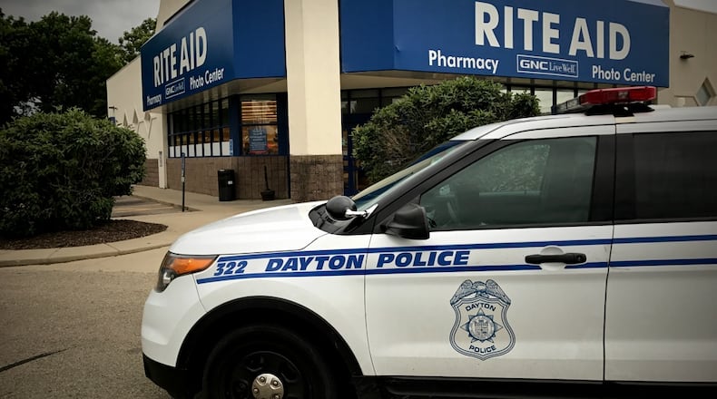 Dayton police responded to a robbery June 7, 2017, at Rite Aid on Linden Avenue. JIM NOELKER / STAFF