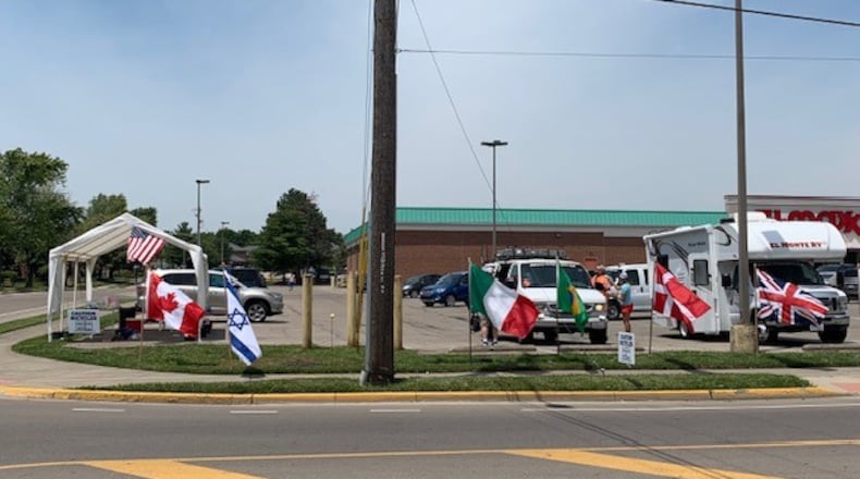 Oxford's time station for Race Across America is known to cyclists as one of the best stops along the 3,000-mile route. Each year, volunteers set out flags from each country represented in the event. CONTRIBUTED