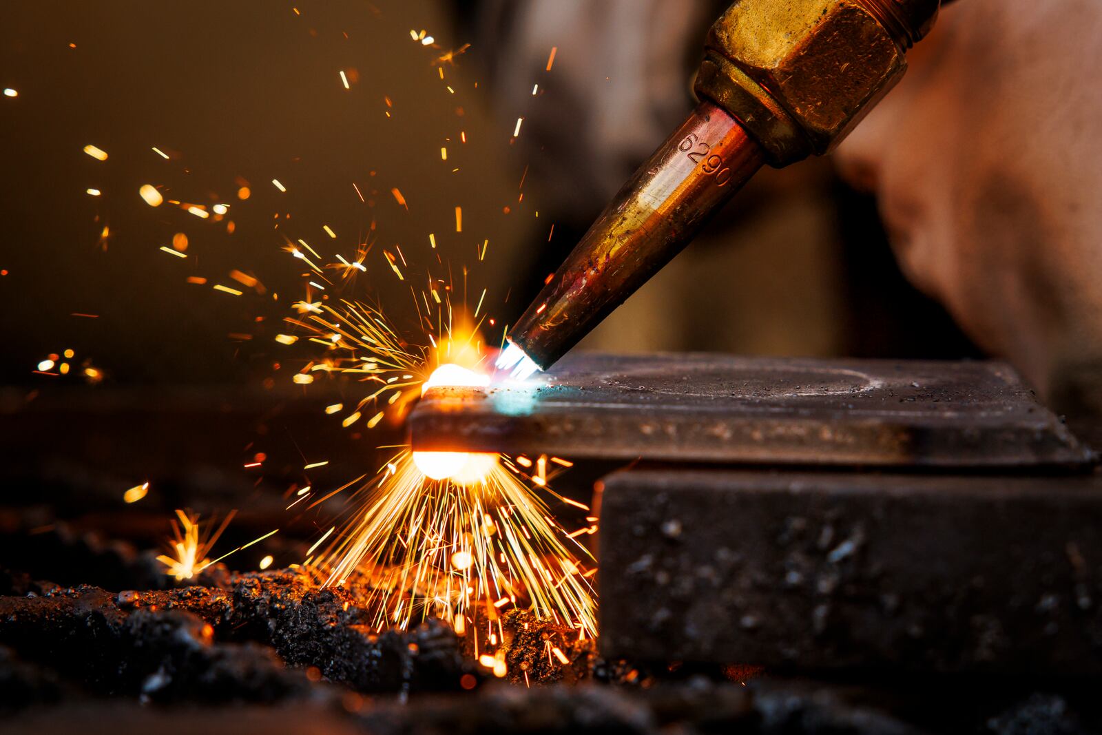 Aaron Fisher, 16, from Hamilton, cuts metal with a torch for a project in the welding program at Butler Tech Wednesday, Oct. 18, 2023 in Fairfield Township. NICK GRAHAM/STAFF