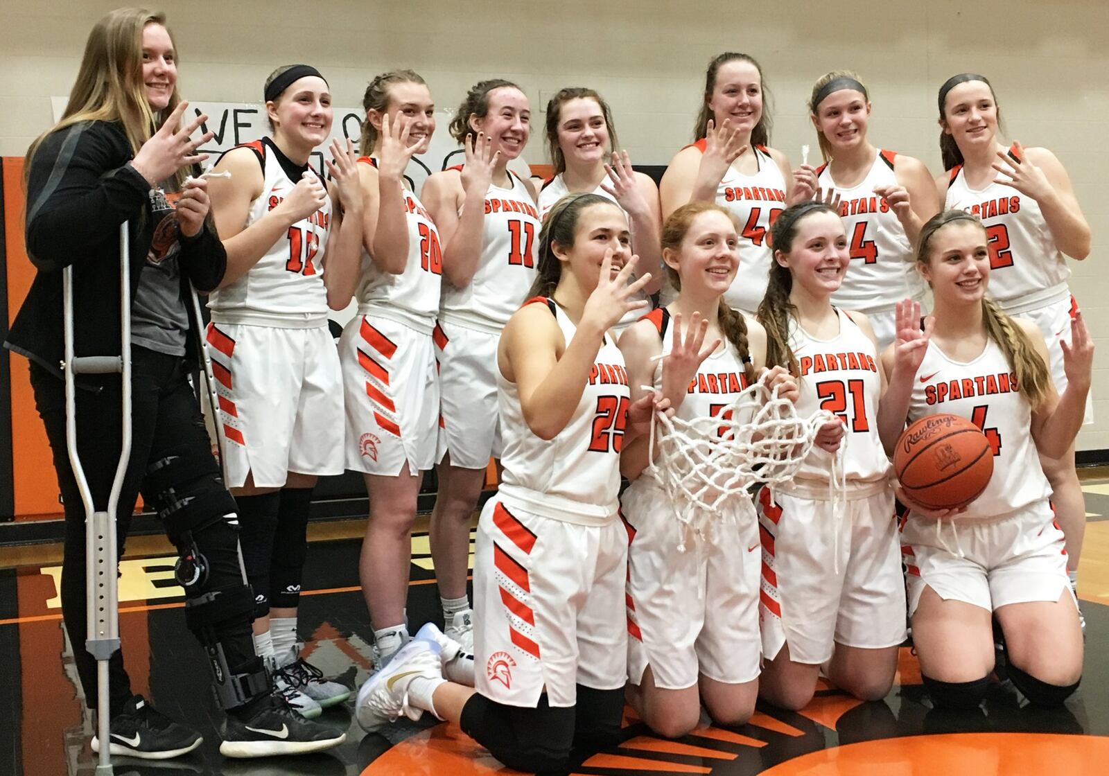 Waynesville’s girls basketball team celebrates its 48-46 win over visiting Franklin on Saturday afternoon. The Spartans improved to 21-0 and have won four straight Southwestern Buckeye League Buckeye Division championships. RICK CASSANO/STAFF