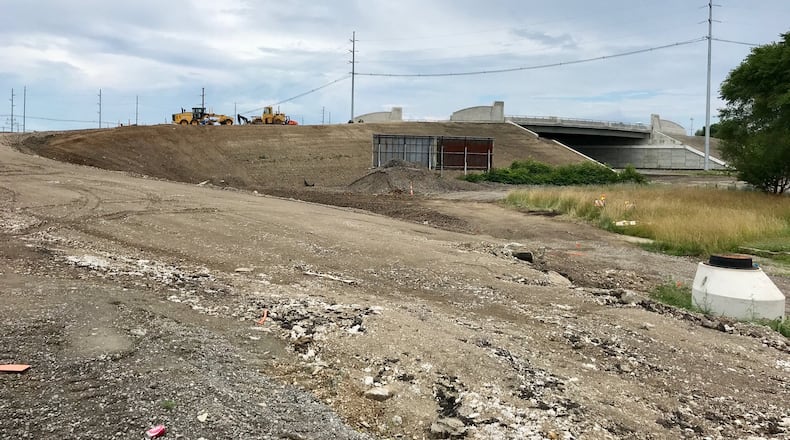 The long-awaited South Hamilton Crossing, sought for more than a century, still has a lot of work to go before it opens in August. NICK GRAHAM/STAFF