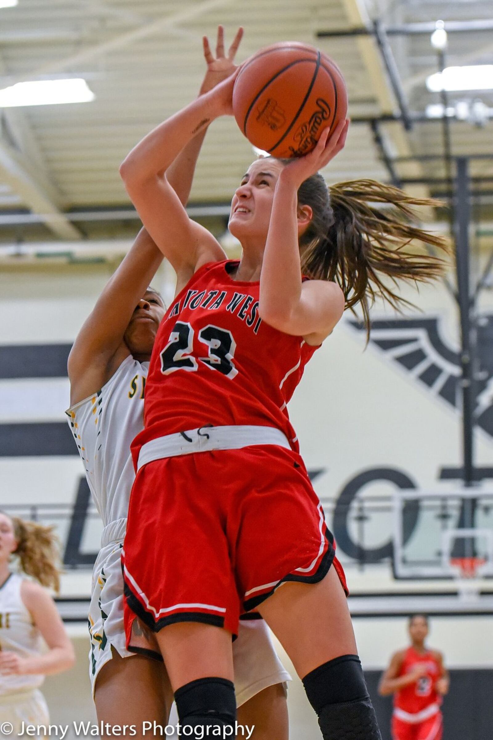 Lakota West’s Kailyn Dudukovich (23) heads toward the basket Monday night during a Division I district basketball semifinal against Sycamore at Lakota East. West won 50-35. PHOTO COURTESY OF JENNY WALTERS PHOTOGRAPHY
