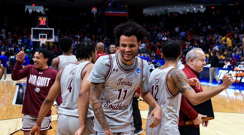 Texas Southern's Bryson Etienne, left, Jordan Gilliam, middle, and John Jones, right, celebrate the team's 76-67 win over Texas A&M-Corpus Christi in a First Four game in the NCAA men's college basketball tournament Tuesday, March 15, 2022, in Dayton, Ohio. (AP Photo/Aaron Doster)