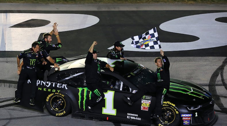 Kurt Busch, driver of the #1 Monster Energy Chevrolet, celebrates with his crew members after winning the Monster Energy NASCAR Cup Series Quaker State 400 Presented by Walmart at Kentucky Speedway on July 13, 2019 in Sparta, Ky. (Daniel Shirey/Getty Images/TNS)