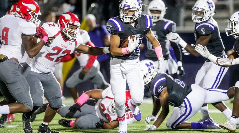 Middletown’s John Calhoun carries the football during their game against Princeton Friday, October 4 at Barnitz Stadium in Middletown. Princeton won 43-21. NICK GRAHAM/STAFF
