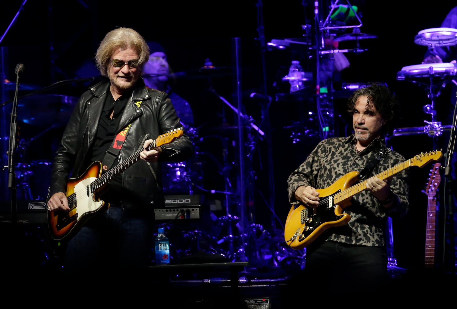 FILE - Daryl Hall, left, and John Oates perform in Glendale, Ariz. on July 17, 2017. (Photo by Rick Scuteri/Invision/AP, File)