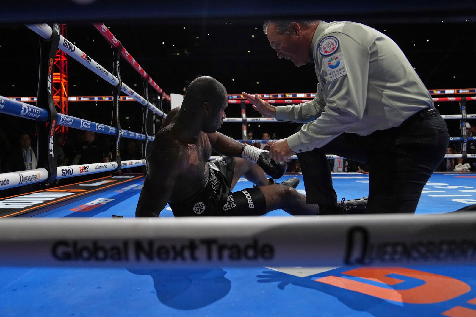 Britain's Daniel Dubois is in on the floor after a knockout by Ukraine's Oleksandr Usyk during the undisputed world heavyweight boxing title fight In London, Saturday, July 19, 2025. (AP Photo/Frank Augstein)