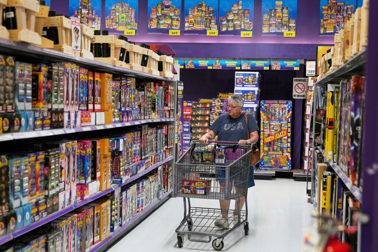 Peggy Senich shops at a Phantom Fireworks in Youngstown, Ohio, Wednesday, June 25, 2025. (AP Photo/Sue Ogrocki)