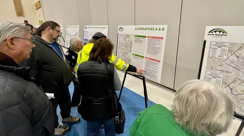 Scores of residents from Hamilton and neighboring communities attended the north Hamilton Crossing open house at Fairgrove Elementary in Hamilton Monday evening, Jan. 23, 2023. Attendees viewed the several alternative options for routes to cross the Great Miami River to create a new east-west access for traffic. In addition to informational, posters, officials from the city, the Ohio Department of Transportation, and the project management firm Stantec were available to answer questions and address comments. MICHAEL D. PITMAN/STAFF
