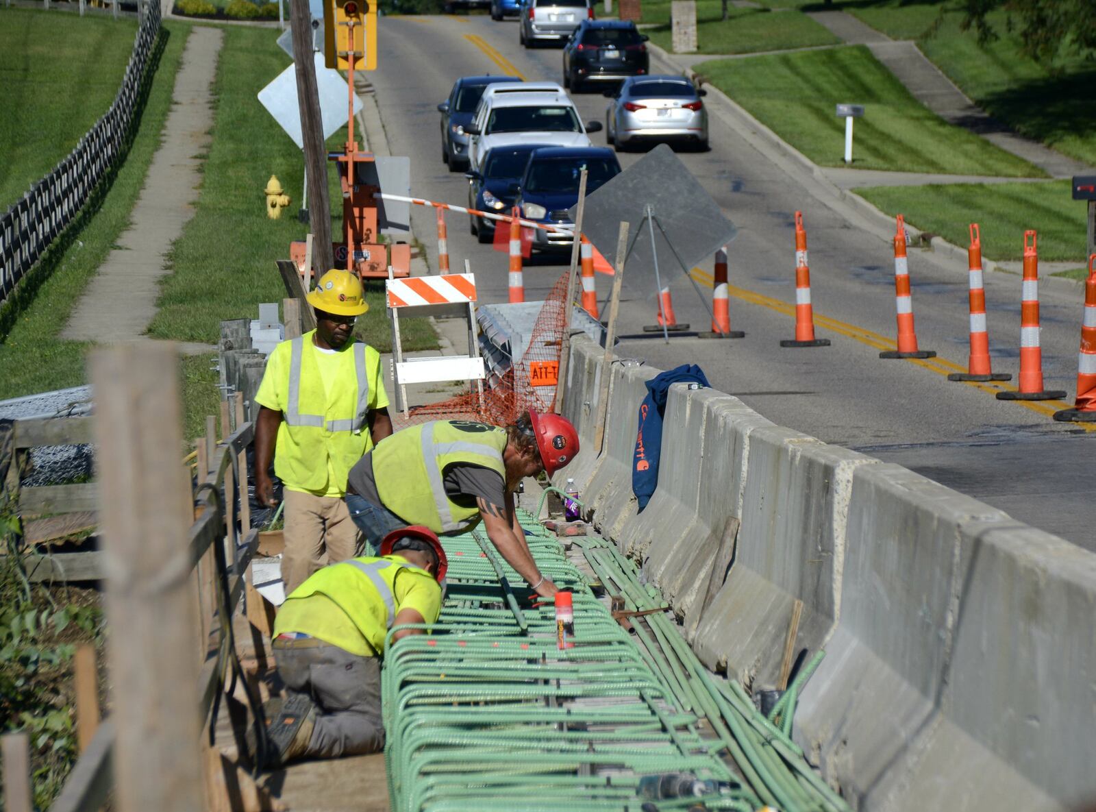 The Resor Road bridge repair project on Aug. 28, 2019, in Fairfield. This bridge in front of the Fairfield golf course is one of three bridges on Resor and Winton roads being repaired this summer by Sunesis Construction. The Ohio Department of Transportation, through the assistance of a grant, will inspect all 23 vehicular bridges in the city in 2020. MICHAEL D. PITMAN/STAFF