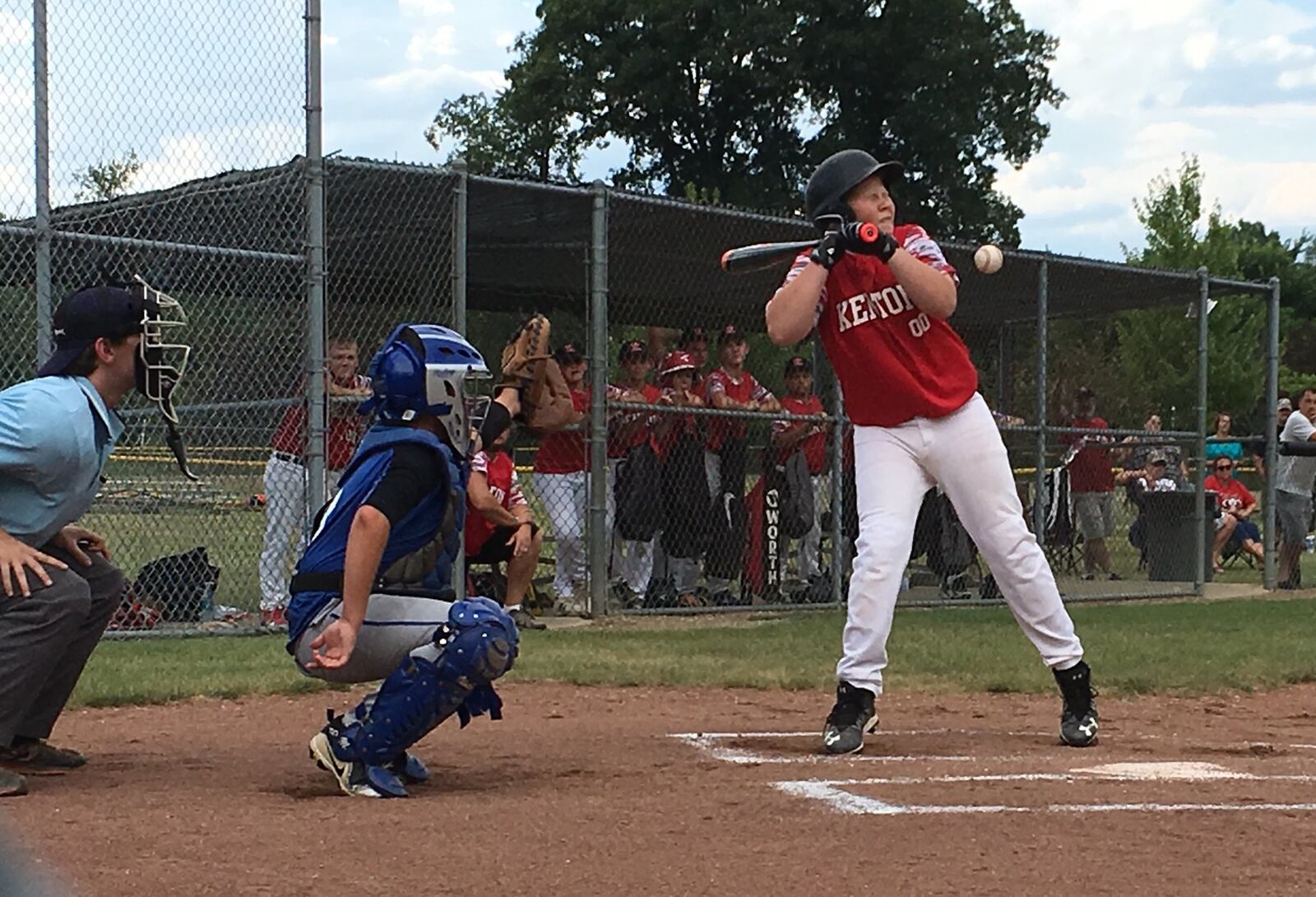 Kenton’s Tyson Hopkins gets plunked by a pitch from Hamilton West Side’s Jonathan Alcorn during Monday night’s Ohio Little League Tournament game at the Hoover Community Recreation Complex in North Canton. West Side won 11-1. RICK CASSANO/STAFF