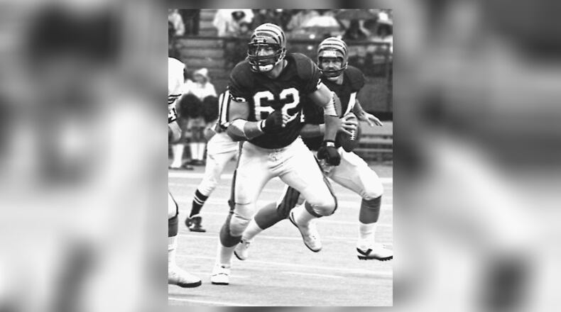 Cincinnati Bengals offensive lineman Dave Lapham (62) blocks for quarterback Ken Anderson during the 1983 season. Lapham was recently selected for induction into the team's Ring of Honor. CINCINNATI BENGALS / CONTRIBUTED